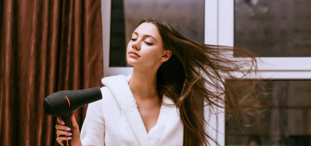 Blow-drying hair in winter